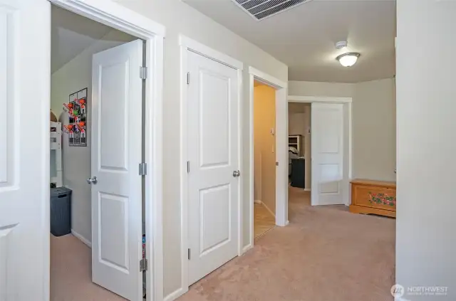 The upstairs landing connects all five bedrooms and the utility room, creating a functional and efficient layout.
