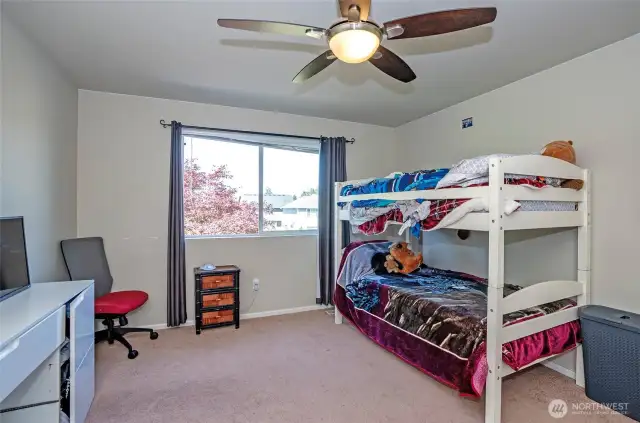 Located at the top of the stairs, Guest Suite #4 boasts plenty of space and natural light.