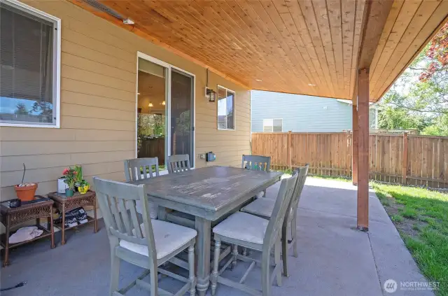 Enjoy outdoor living year-round on the covered patio, perfect for dining, entertaining, or relaxing beneath the beautifully crafted tongue-and-groove ceiling.