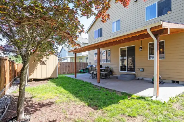 Another angle of the covered patio reveals a perfect balance of comfort and everyday functionality.