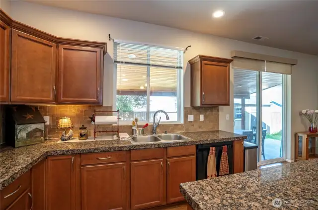 Enjoy this additional kitchen view, where the sink offers a lovely sightline to the covered patio and backyard.