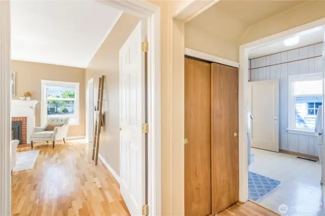 Hall closet with entry into laundry room.