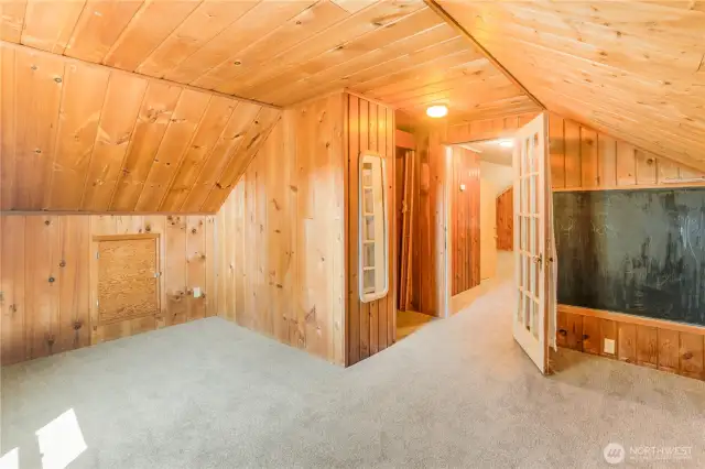 Third bedroom has tongue and groove  wood walls and ceiling
