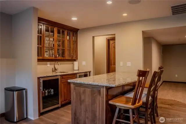 Wet bar with wine cooler and beverage cooler in rec room