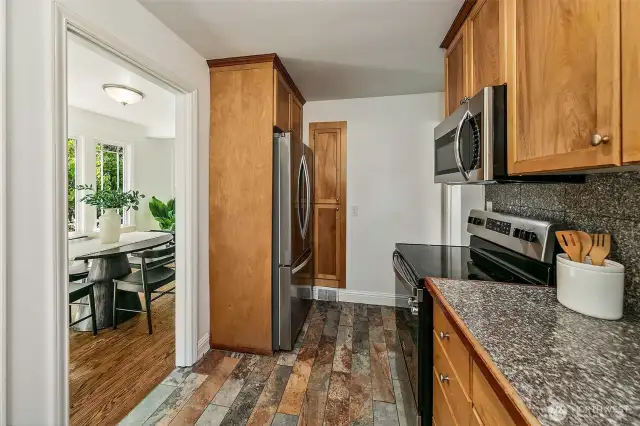 Kitchen has plenty of storage and direct access to the backyard.