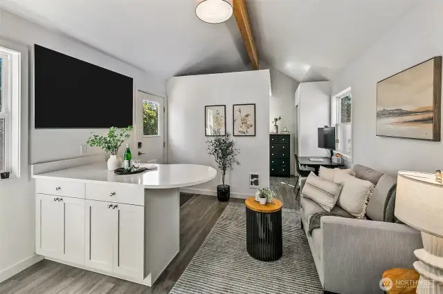 High ceilings, full kitchen.