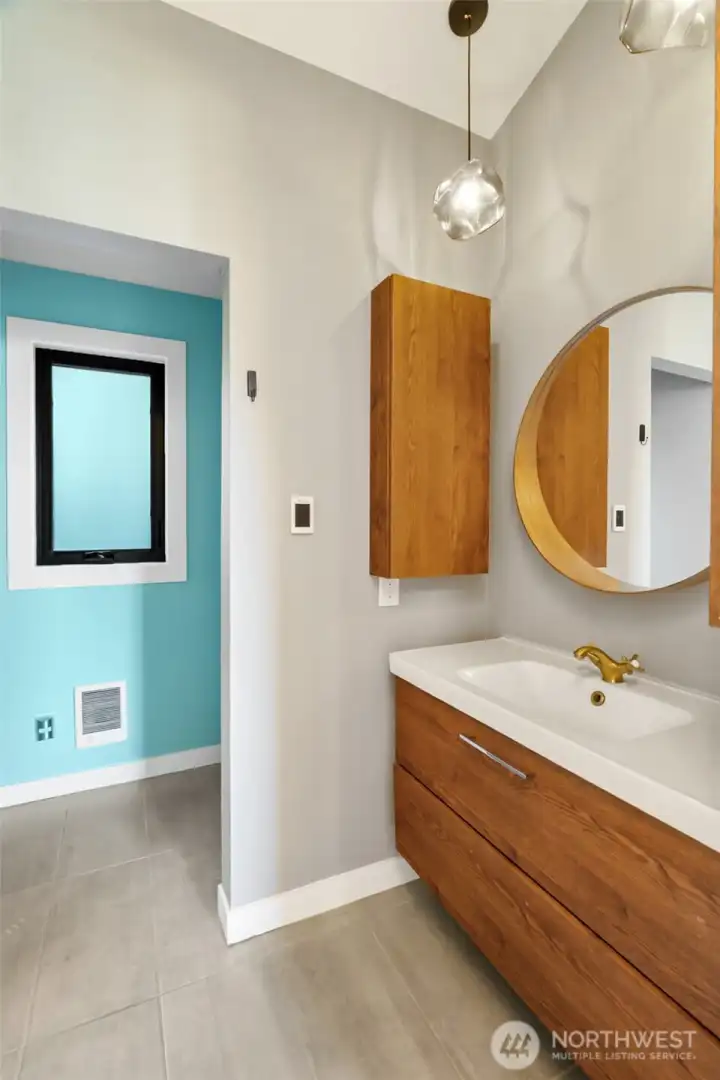 Floating cabinet, updated lighting, and heated tile floors
