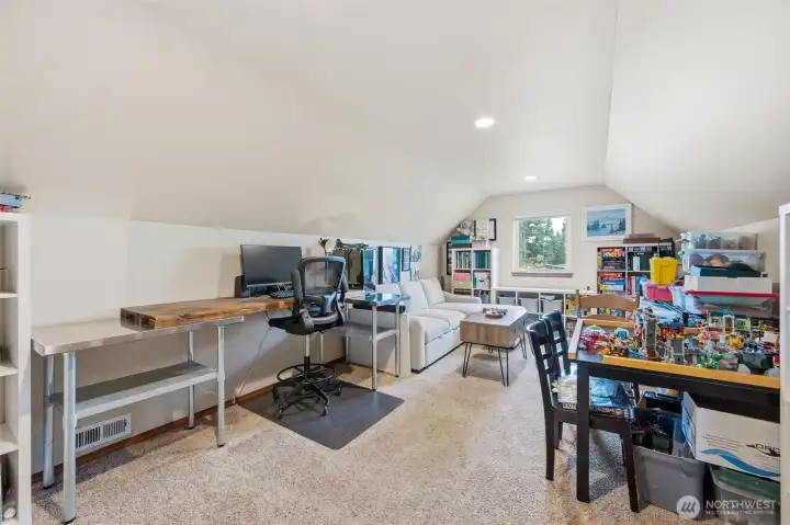 Huge bedroom (#3) or bonus room on upper level above the garage. This room has a closet so it could live either way you need it to