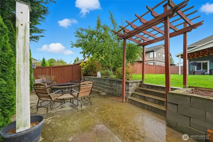 Outdoor firepit on another large concrete patio
