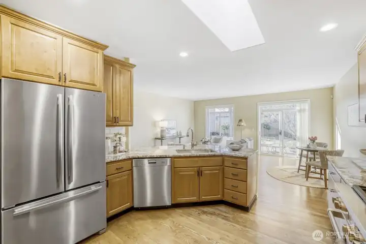 Kitchen with Wolf range, JennAir refrigerator and a Miele dishwasher