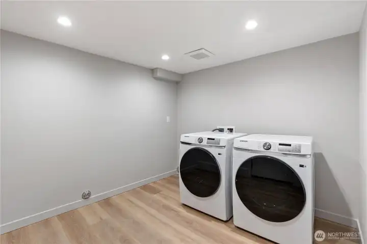 Across the hall from the lower level bedroom is a large laundry room that also connects to the garage and would be a perfect mudroom.