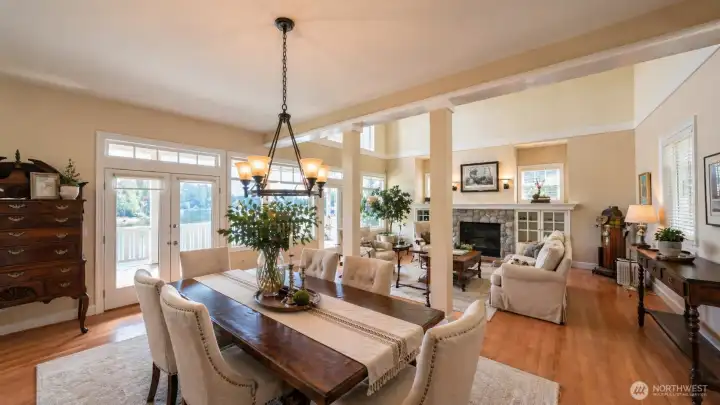 Built in 1997 and updated through 2025, the layout includes a flex room, three fireplaces, and a 3-bay garage with RV parking on a 0.548-acre lot. The main level features a chef’s kitchen with quartz and granite surfaces, including an AGA cookstove, connected to open living and dining areas with lake views. The primary suite includes a gas fireplace and a remodeled 2025 bathroom with heated floors and soaking tub. The lower level includes a private entrance, full second kitchen, and separate living space for flexible use. System improvements include geothermal HVAC, central A/C, and wired generator capability.