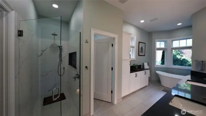 The primary suite includes a gas fireplace and a remodeled 2025 bathroom with heated floors and soaking tub.