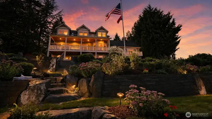 This 3+bedroom, 3.5-bath waterfront home on Long Lake in Lacey offers 4,787 square feet, 105 feet of no-wake shoreline, and a daylight basement with separate entrance and second kitchen for multi-generational living or guest use. Built in 1997 and updated through 2025, the layout includes a flex room, three fireplaces, and a 3-bay garage with RV parking on a 0.548-acre lot. The main level features a chef’s kitchen with quartz and granite surfaces, including an AGA cookstove, connected to open living and dining areas with lake views. The primary suite includes a gas fireplace and a remodeled 2025 bathroom with heated floors and soaking tub. The lower level includes a private entrance, full second kitchen, and separate living space for flexible use. System improvements include geothermal HVAC, central A/C, and wired generator capability.