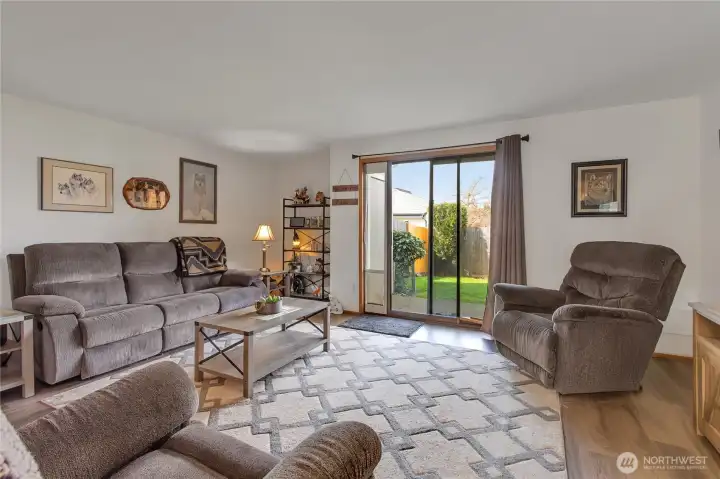 Slider to Patio off living room, fully fenced yard & storage closet off patio