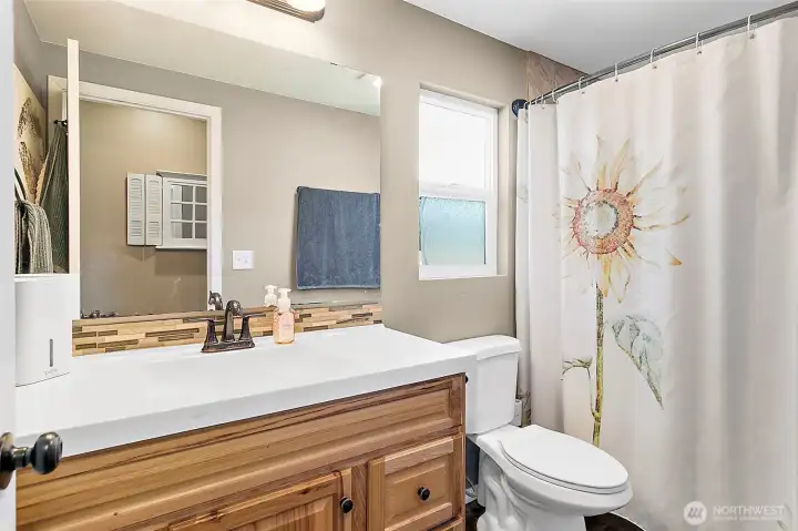 Main full bath with lots of countertop space. Wow!