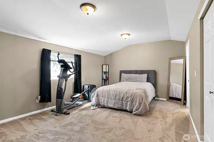 Large Primary Bedroom with ample space for bed, workout equipment or a desk for working from home.