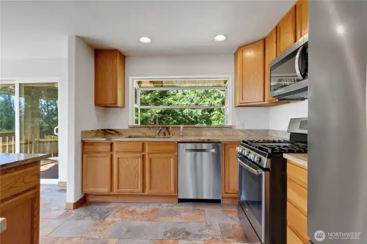 Kitchen has garden window.