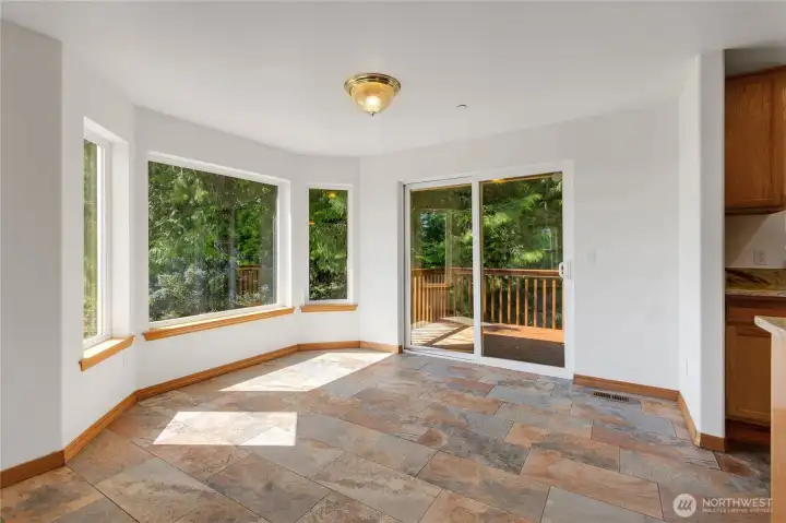 Dining area with upper deck access.