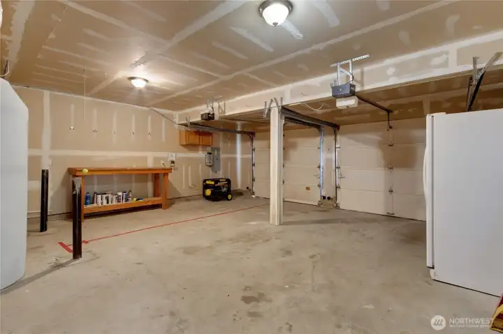 Garage wired for generator, generator stays, fridge stays