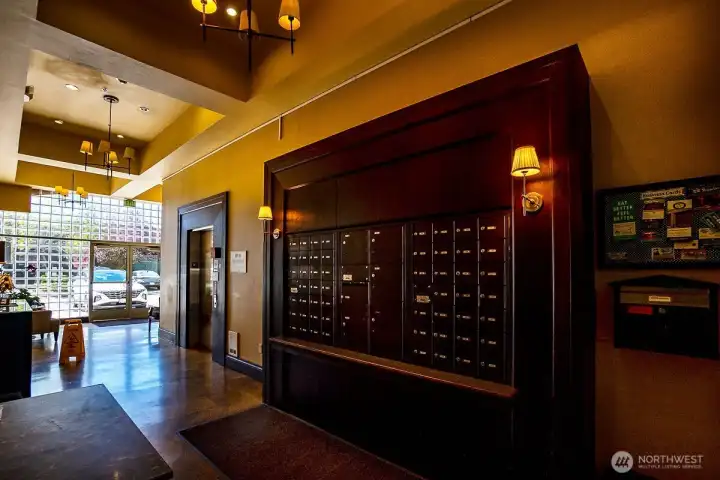 Main entry elevator, mail boxes, sitting area, and one of the courtyard entries Main entry elevator, mail boxes, sitting area, and one of the courtyard entries