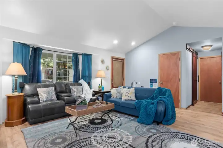 Living room, looking at front door, living room and primary bedroom