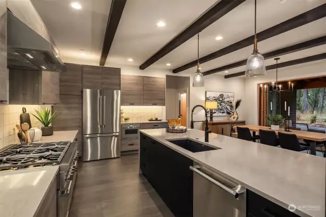 Curate five-star meals at home using the six-burner gas range, high-end stainless steel appliances, quartz counters with waterfall island, and a gracious layout.