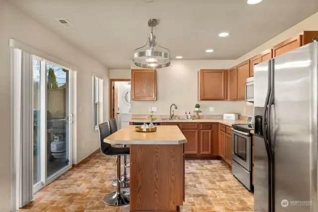Spacious kitchen w/island and slider access to backyard.