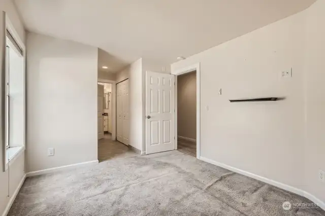 Primary bedroom with large closet and full bathroom