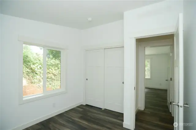 Closet space for storage in the Great Room.  Door into the Primary Bedroom that is at the opposite side of the house than the other rooms.