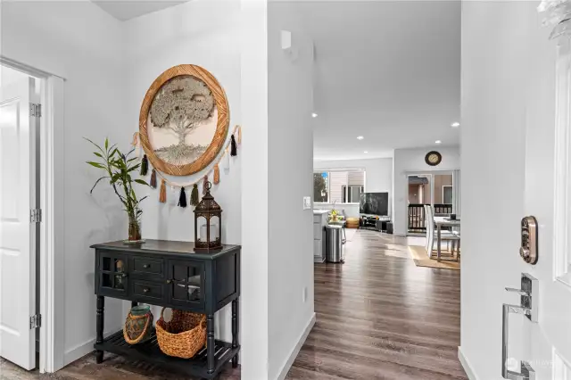 Upper level entry with vinyl plank flooring that flows throughout the main living areas.