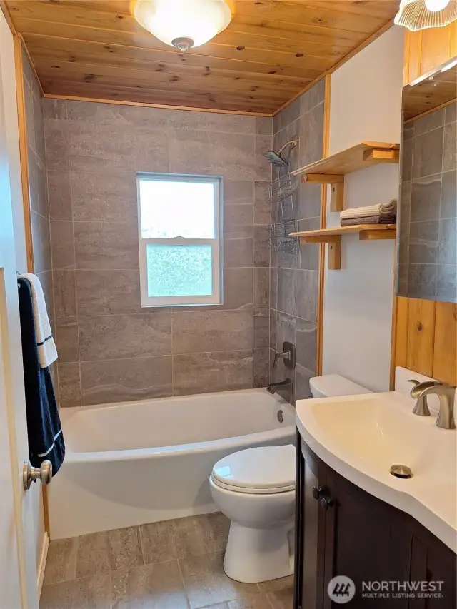 Beautiful tiled bath with shower