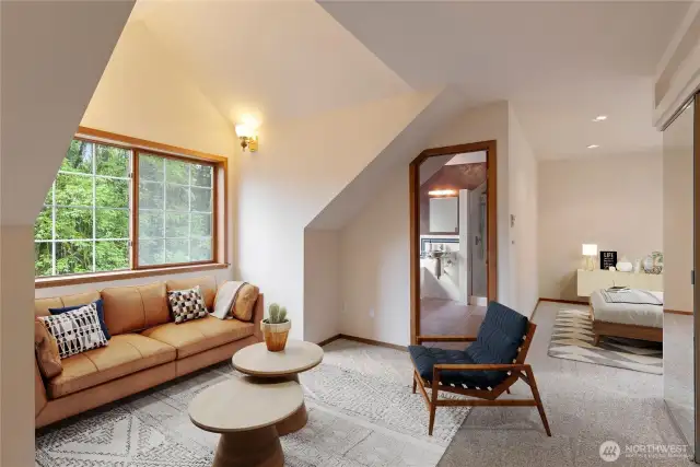 Part of the primary suite.  This space can be a changing area with more dressers or a sitting area.  Lots of closet space in this room and throughout the home.
