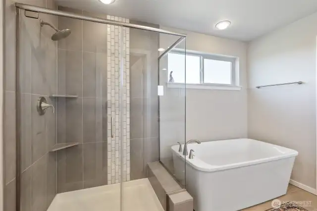 Primary shower & soaking tub! Continuous hot water allows you to fill the bathtub.