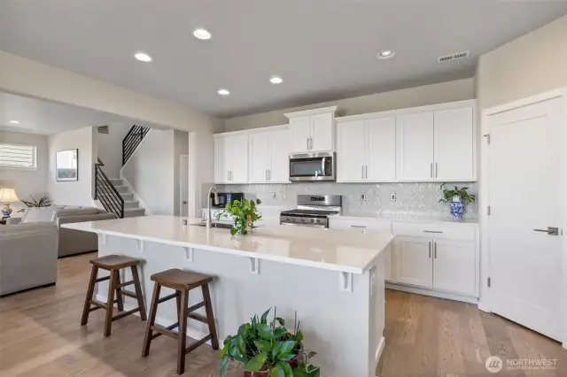 Breakfast bar with quartz countertops.