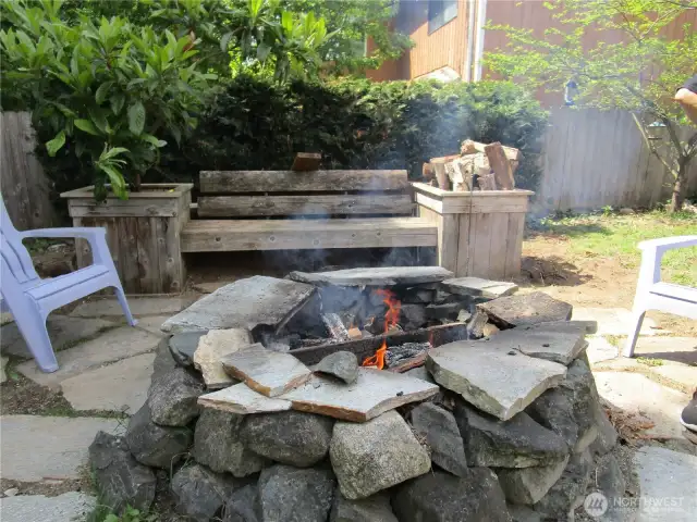 Back yard fire pit  with built in  sitting area.