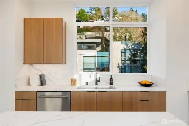 Ample cabinets & quartz countertops!  Stainless appliances.  Photos are staged model of same floorplan.  Color schemes may vary.
