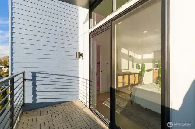Primary Suite Balcony is the perfect spot to serenely start and/or end your days.  Photos are staged model of same floorplan.  Color schemes may vary.