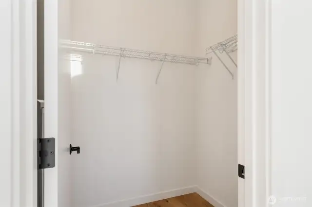 Primary suite walk-in closet.