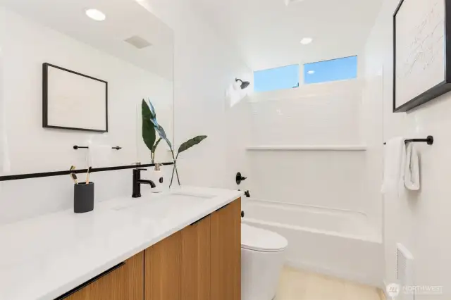 Full bath on the second level.  Photos are staged model of same floorplan.  Color schemes may vary.