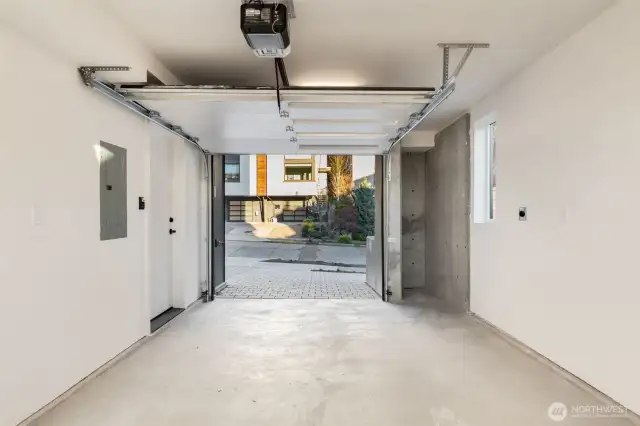 Attached garage with space for storage.