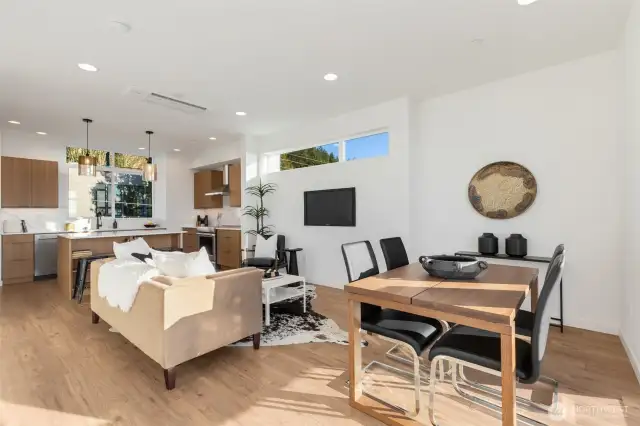 Abundance of window throughout bathe the home in natural light.  Photos are staged model of same floorplan.  Color schemes may vary.