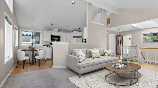 Lookin from living to kitchen/dining area. Virtually staged