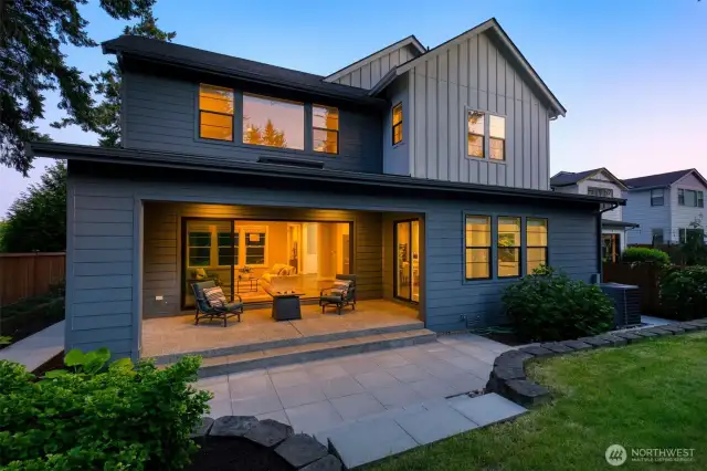 Unwind in the peaceful privacy of this covered outdoor living space, seamlessly connected to the interior through expansive sliding glass doors. With a spacious patio, cozy seating area, and lush landscaping, it's the perfect setting for entertaining or relaxing under the stars.