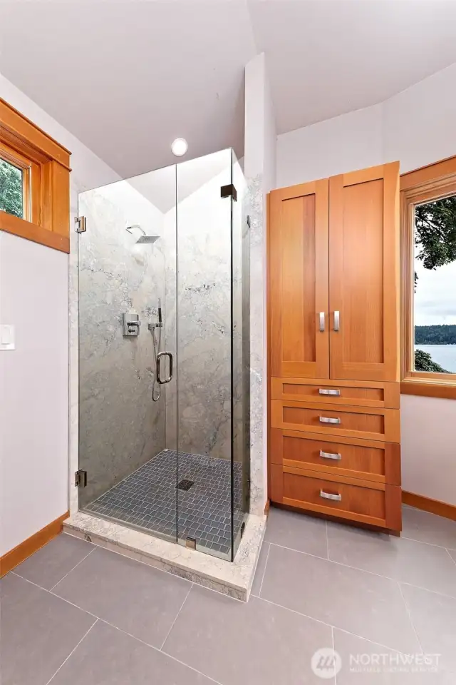 Custom marble shower in the primary bath as well.