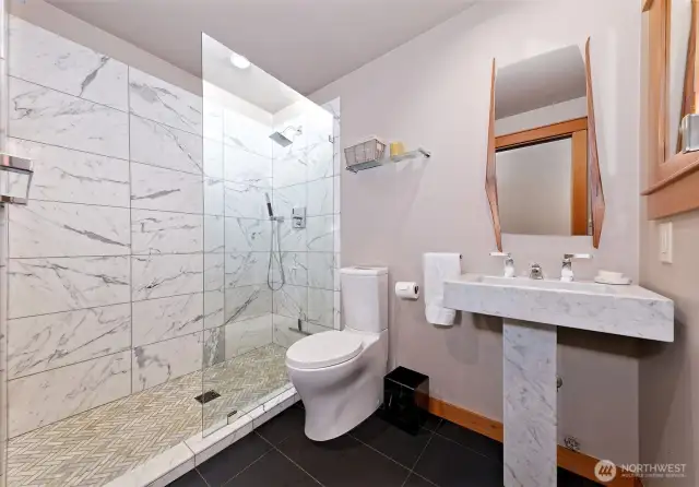 The main bath features a wonderful shower and this awesome marbel sink!