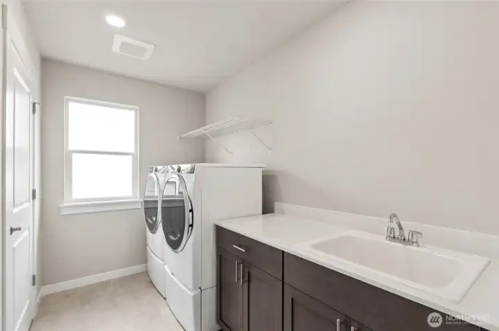 Upstairs utility room.  Photo is representational. Actual home is under construction and finishes and colors will vary. See site agent for details.