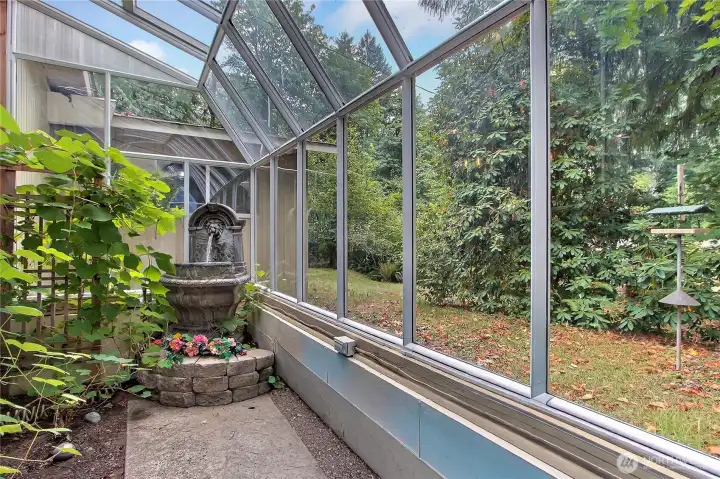 Grow your own produce with this attached greenhouse!