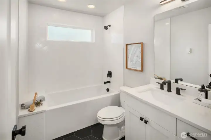 Full bathroom next to second bedroom.