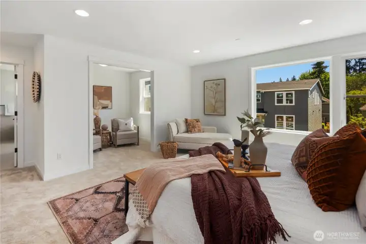 Primary Bedroom with Sitting Area: Designed for flexibility, the primary suite opens to a bright sitting nook that can serve as a private lounge, reading corner, or workspace. The seamless connection between spaces enhances both comfort and usability. Staged photos are of the model home of the same floorplan within the Foxmoore community and are for visualization purposes only. Colors, finishes, and layout can and will vary.